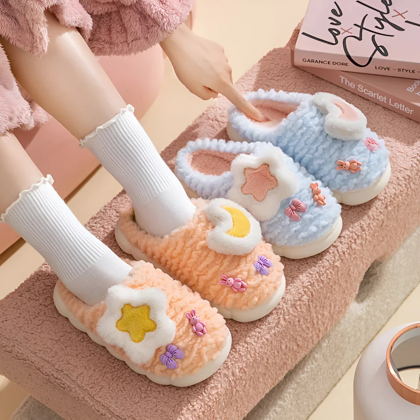 Women's light blue cartoon fleece-lined plush slippers with floral pattern and round toe.