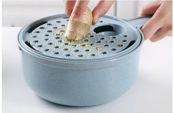8-in-1 mandoline slicer with stainless steel blades, container, drain basket, and hand protector in blue