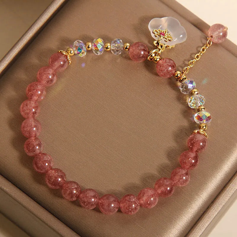 Women's natural crystal bracelet with strawberry quartz and white agate beads, auspicious cloud accents, 40g, on white background