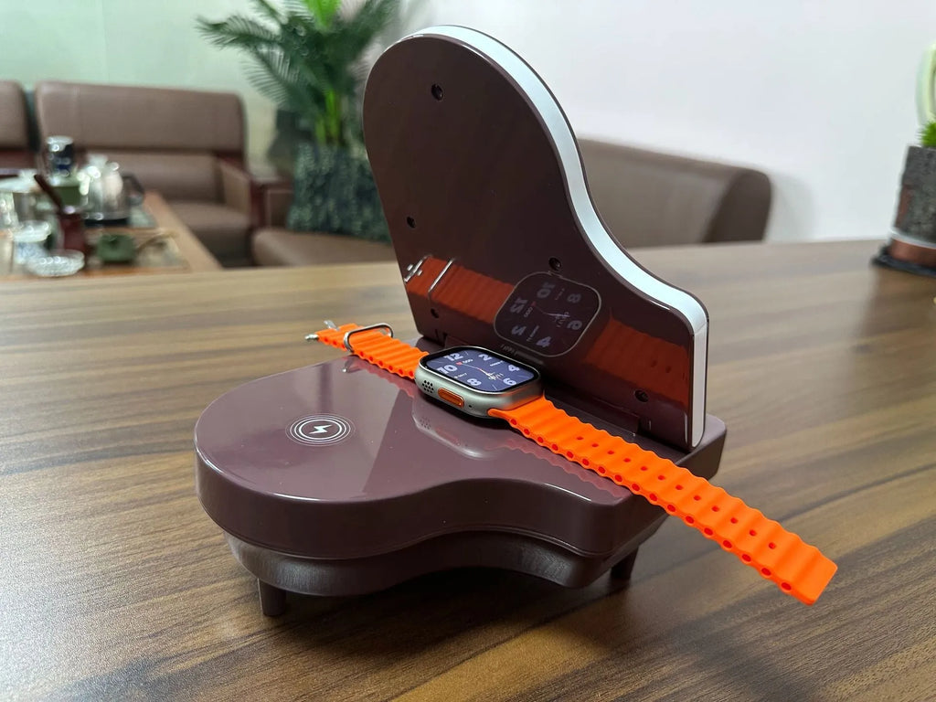 Black multi-function Bluetooth speaker with wireless charger and phone holder showing LED lighting