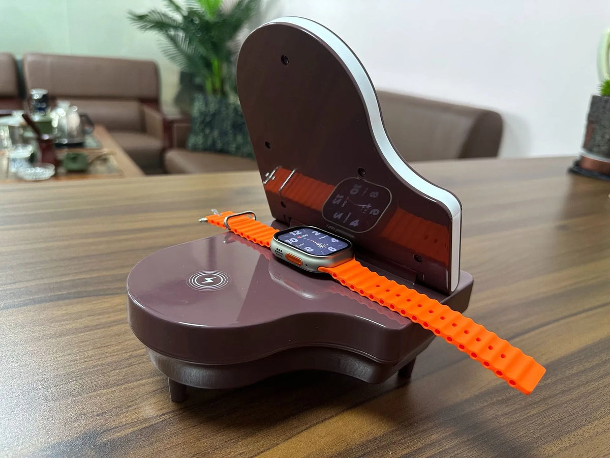 Black multi-function Bluetooth speaker with wireless charger and phone holder showing LED lighting