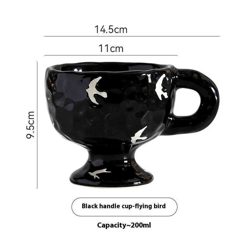 Hand-pinched irregular shaped ceramic mug in a solid colour on a plain background.