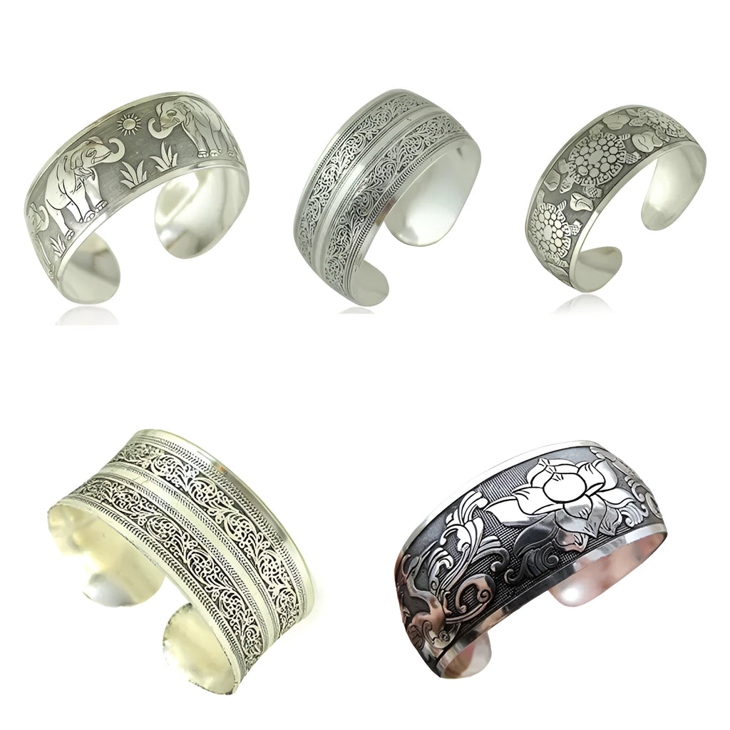 Miao ethnic silver-style bracelet with carved open design in alloy construction