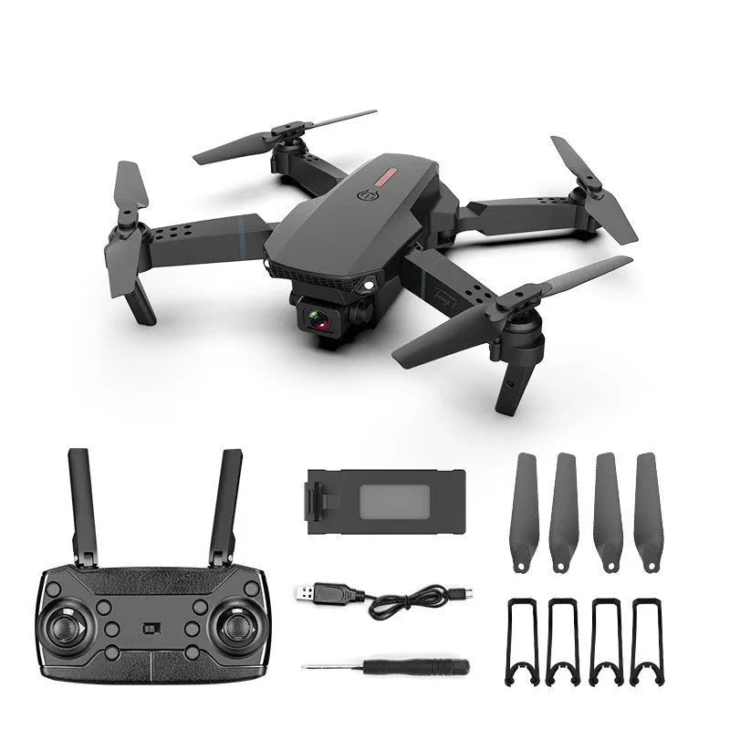 Grey foldable 4K dual camera drone with remote controller and carry bag, shown with propeller blades extended.