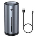 Black aluminium alloy car humidifier and air purifier with USB cable on a car dashboard.