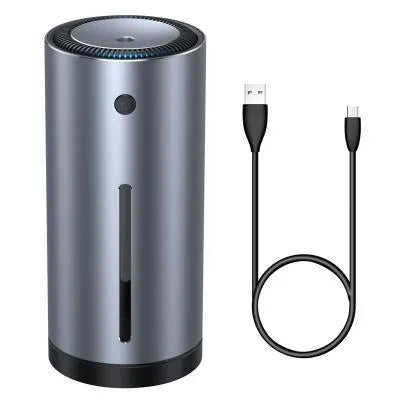 Black aluminium alloy car humidifier and air purifier with USB cable on a car dashboard.