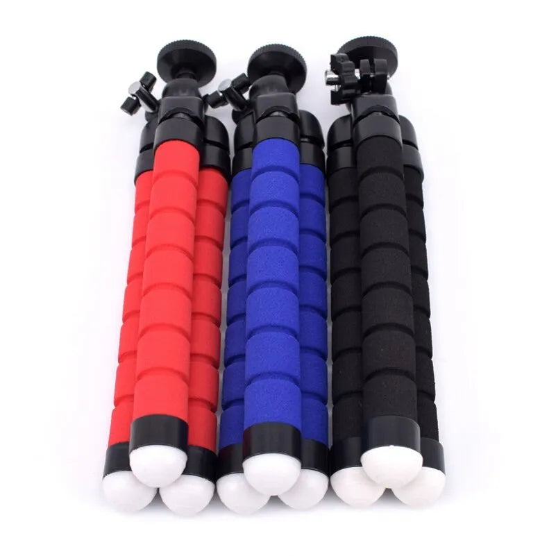 Black flexible octopus tripod with legs wrapped around a pole holding a smartphone
