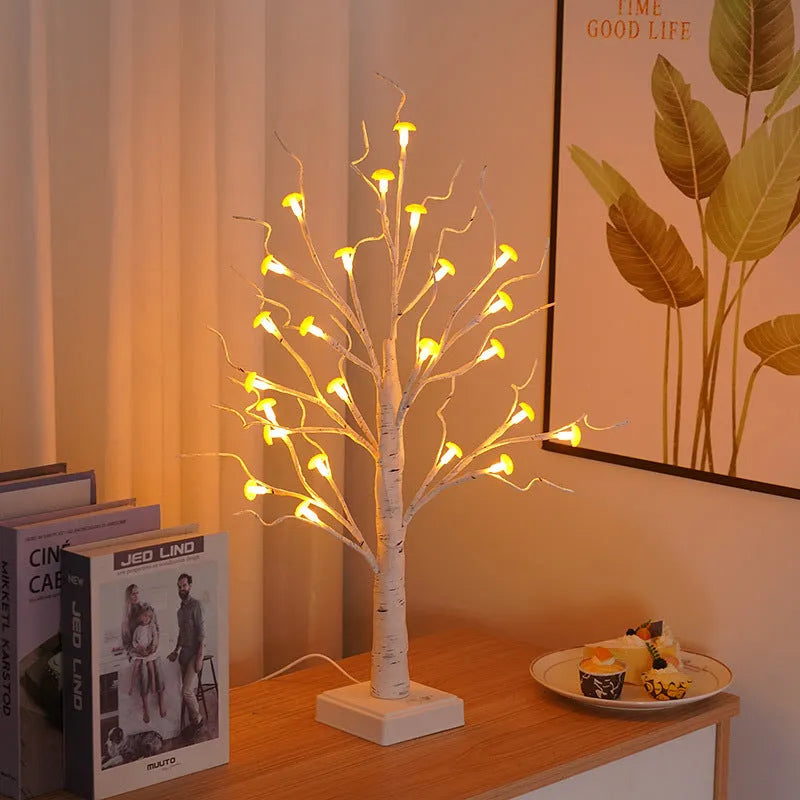 60cm tall white LED birch tree lamp with 24 small plastic mushroom-shaped warm white lights.