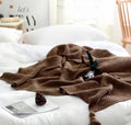 Nordic fringed knit ball blanket in acrylic fabric showing plain pattern and 130×170cm dimensions