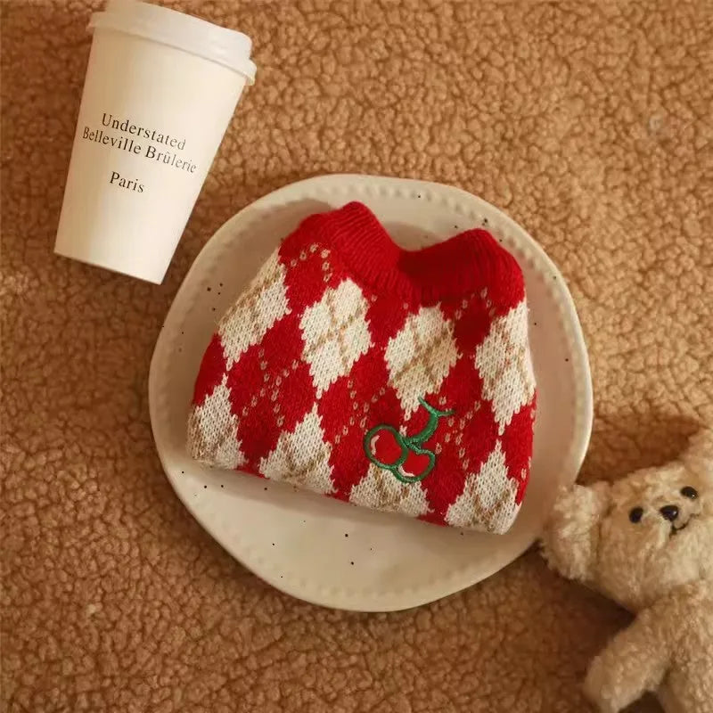 Red cat sweater with rhombus and cherry embroidery, shown in size L on a mannequin.