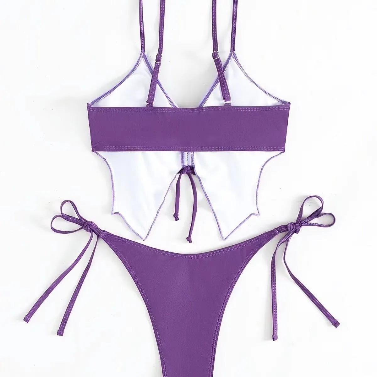 Women's purple bow ins style split bikini suit top and briefs on a mannequin.