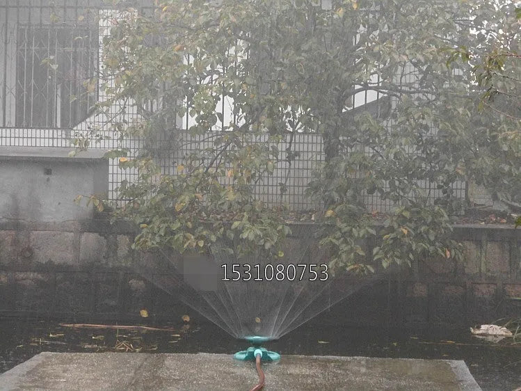 360 rotating garden sprinkler with three-fork base, 210mm x 190mm x 95mm, sprays up to 3m high and 5m wide