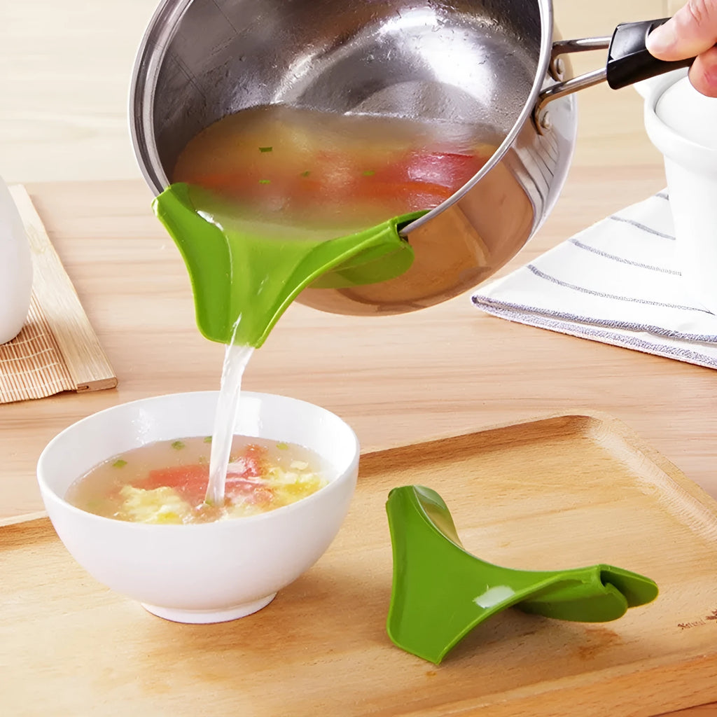 Green silicone kitchen funnel with curved design for clamping onto circular pot rims.