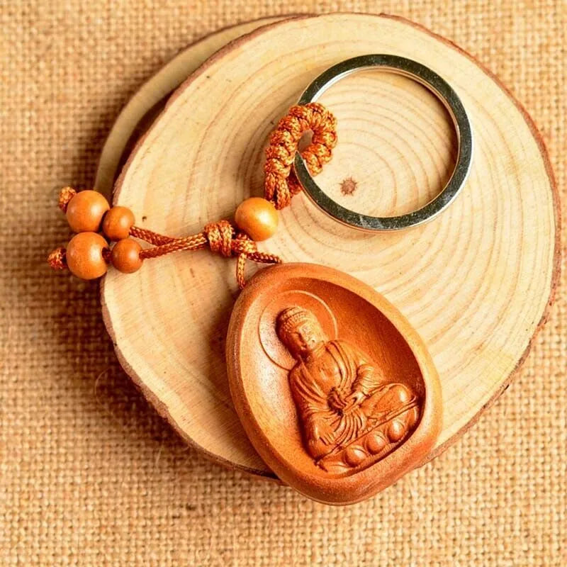Eight patron saint keychains in natural Taomu wood, peach wood colour, 10x3.2x4cm size, orange colour option available