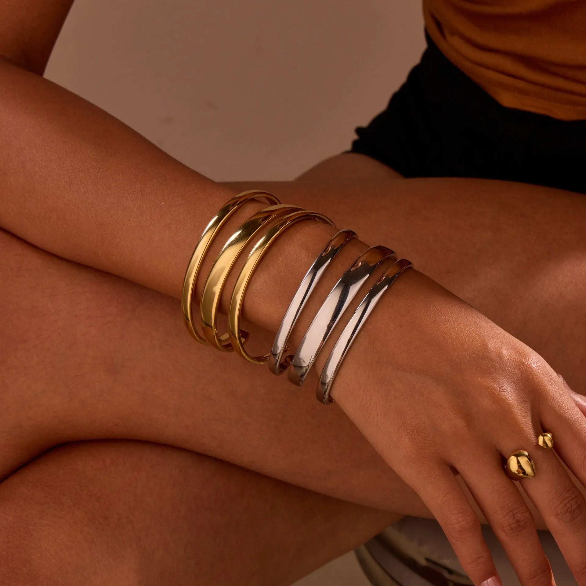 Women's geometric stainless steel bracelet with simple opening clasp in gold tone finish