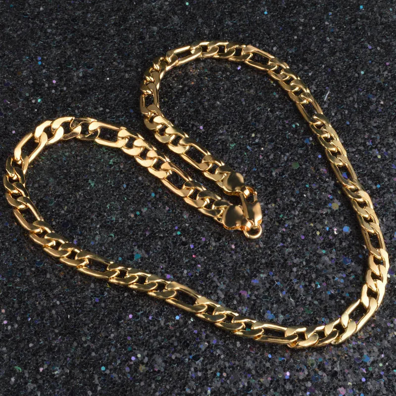 Silver and gold 3:1 chain necklace and bracelet set on a display stand