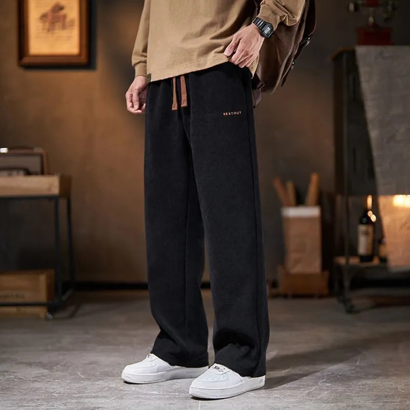 Men's loose straight-leg fleece-lined trousers in dark gray, polyester fabric, mid-rise waist, side view