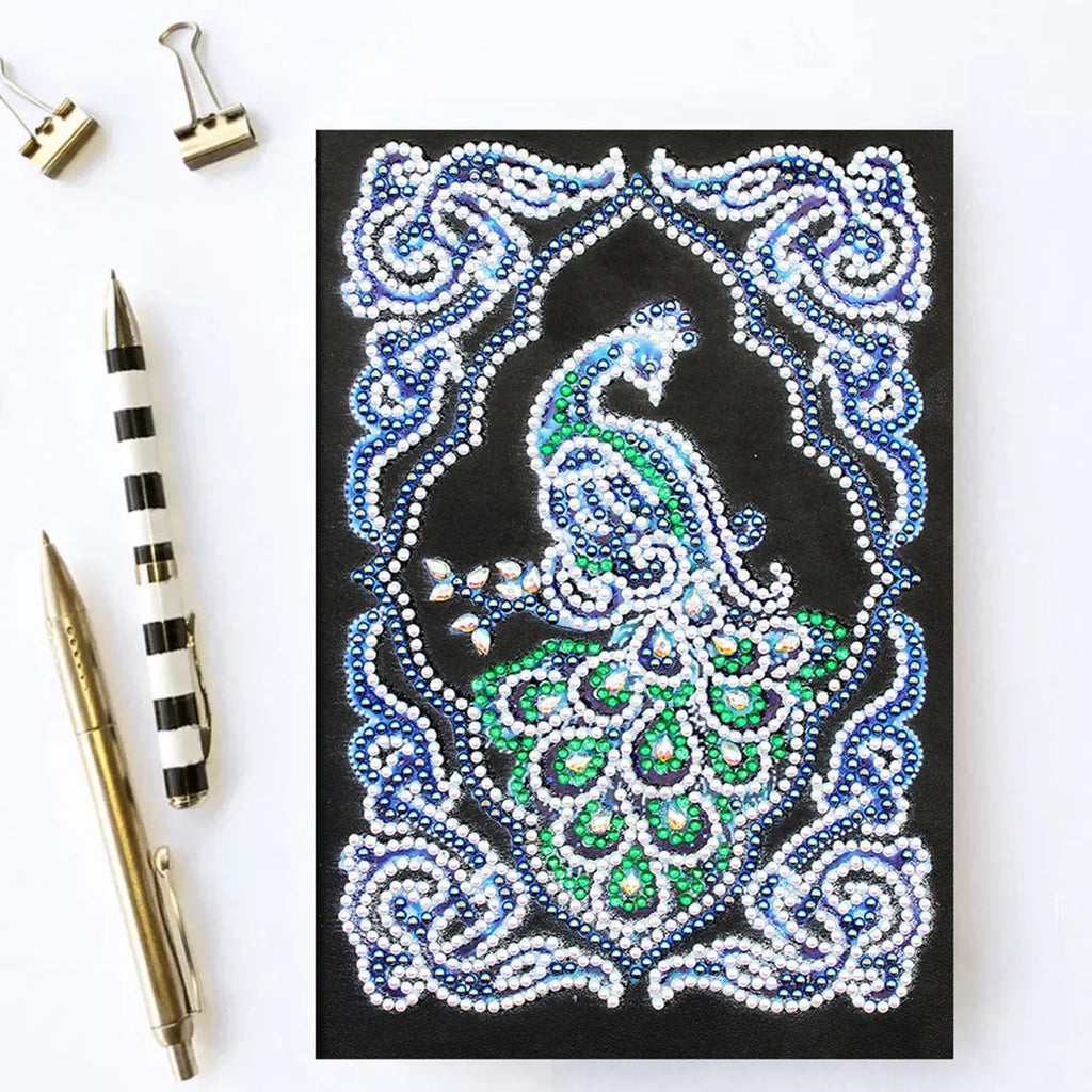 Peacock Beauty A5 diamond painting journal with black cover, shaped and bright drills, showing 142x207mm dimensions.