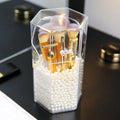 Transparent acrylic makeup brush storage bucket in solid colour plastic on bedroom countertop