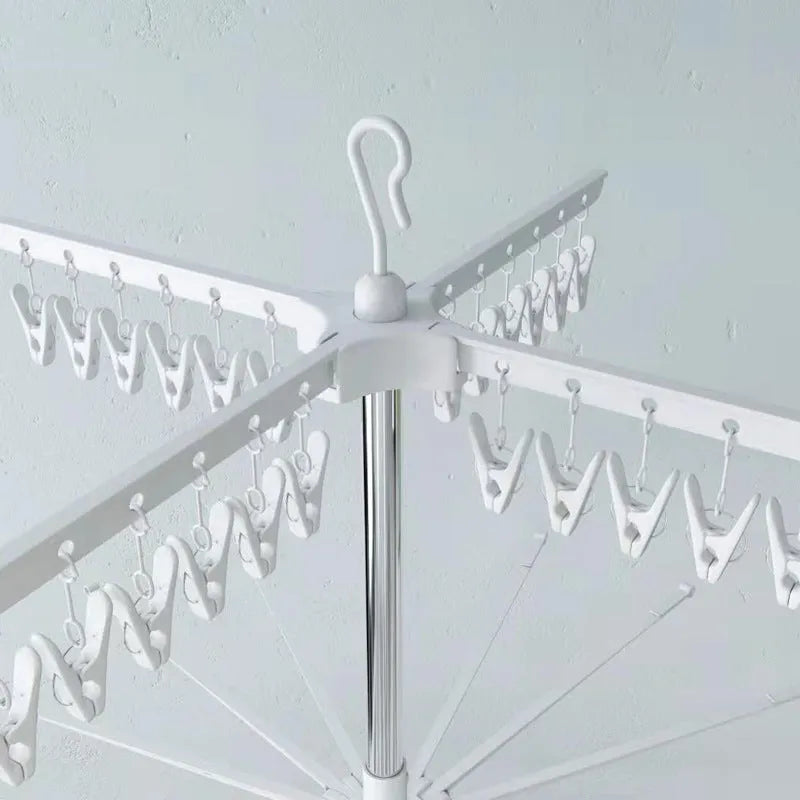 Three-layer stainless steel clothes drying rack with plastic clips for socks, ties, and trousers organisation
