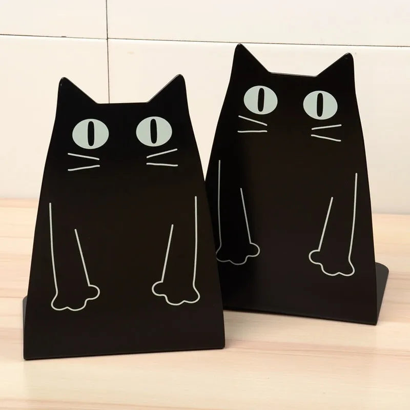 Pair of blue iron bookends measuring 14 x 20.5 x 10.5 cm on a shelf holding books upright