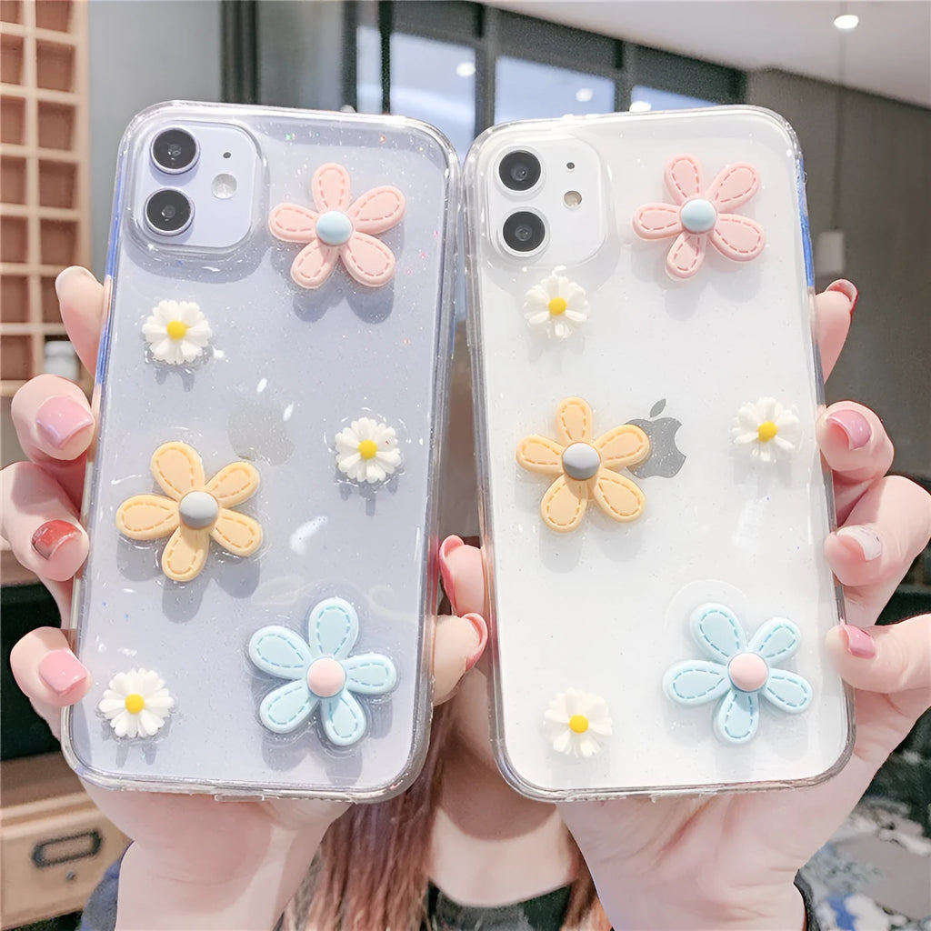 Soft rubber iPhone case with pink floral and girl heart pattern, shown fitted on a phone.