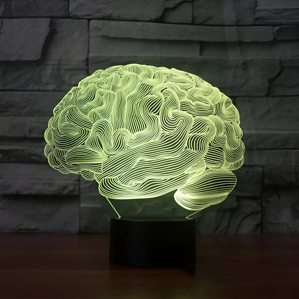 3D acrylic illusion desk lamp with colourful LED lights on a wooden desk, remote control nearby.