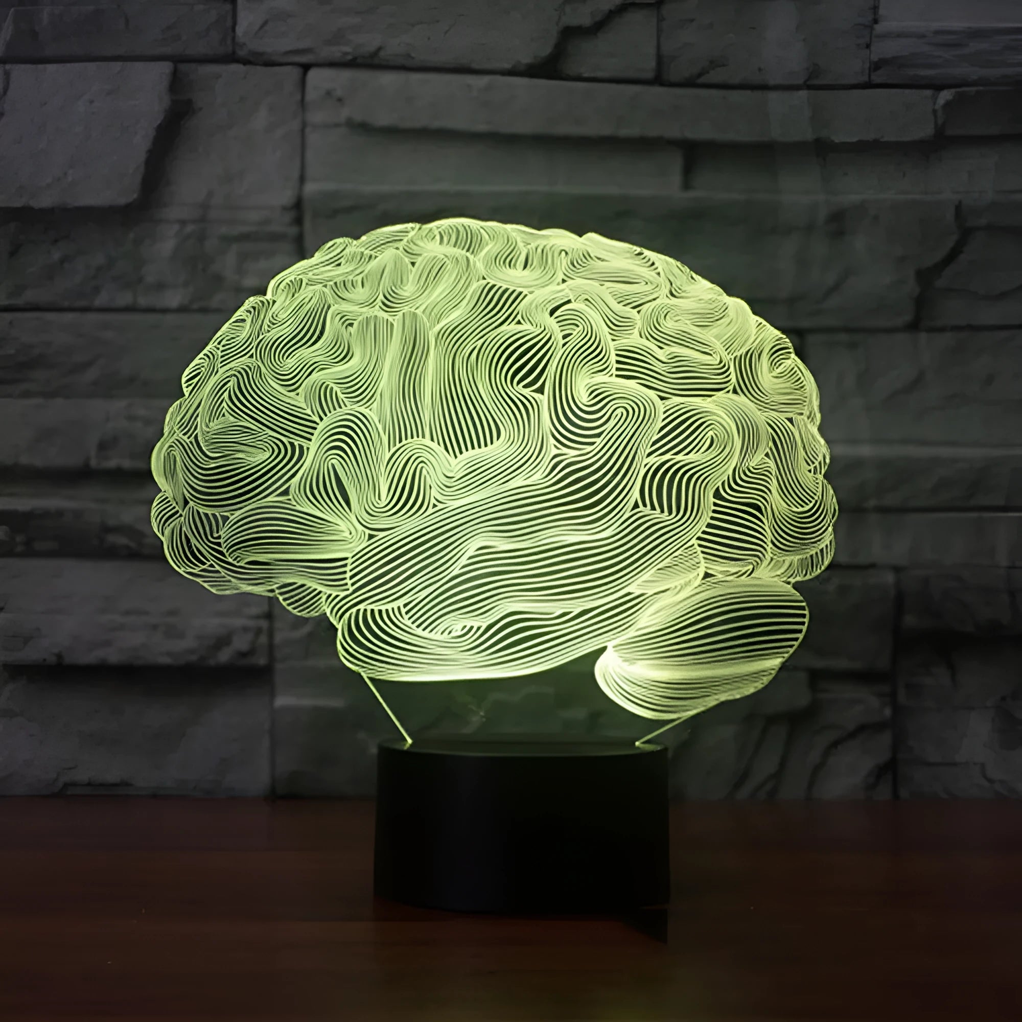 3D acrylic illusion desk lamp with colourful LED lights on a wooden desk, remote control nearby.