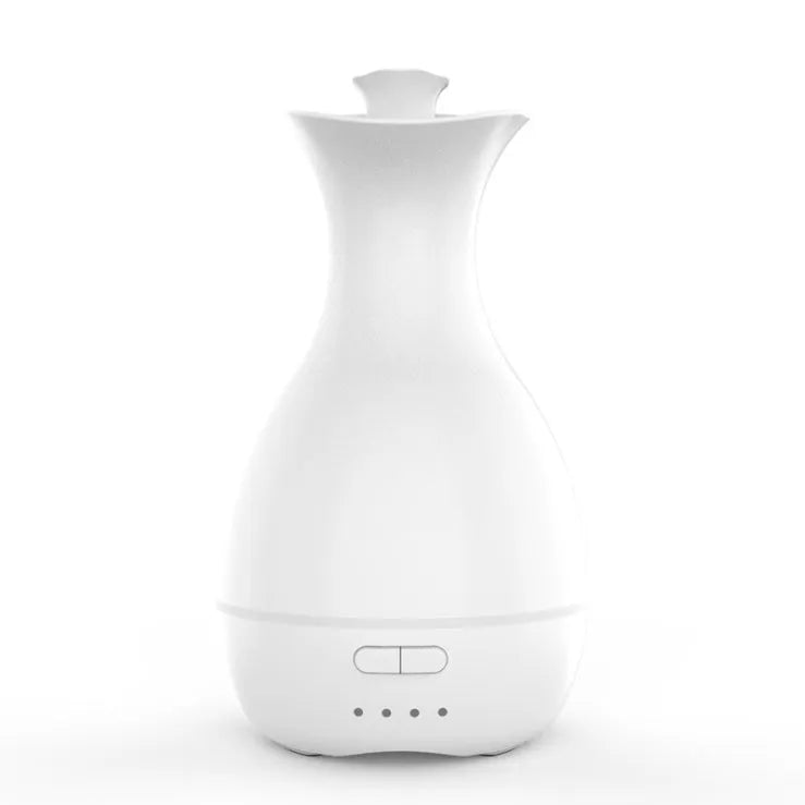 White ultrasonic humidifier with colourful night light functioning as aromatherapy diffuser and flower vase