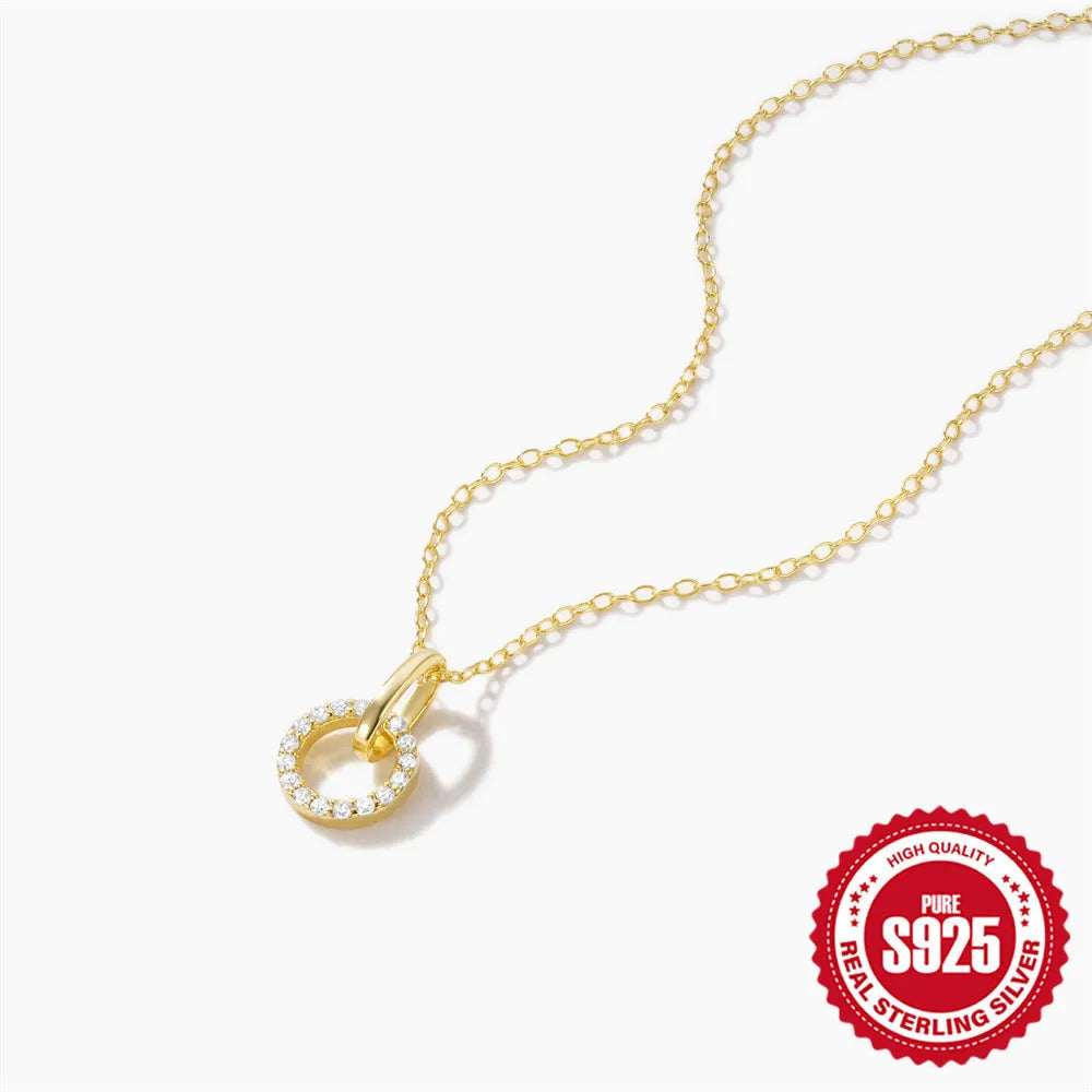 Gold-coloured geometric sterling silver pendant necklace with zircon detail on an adjustable chain.