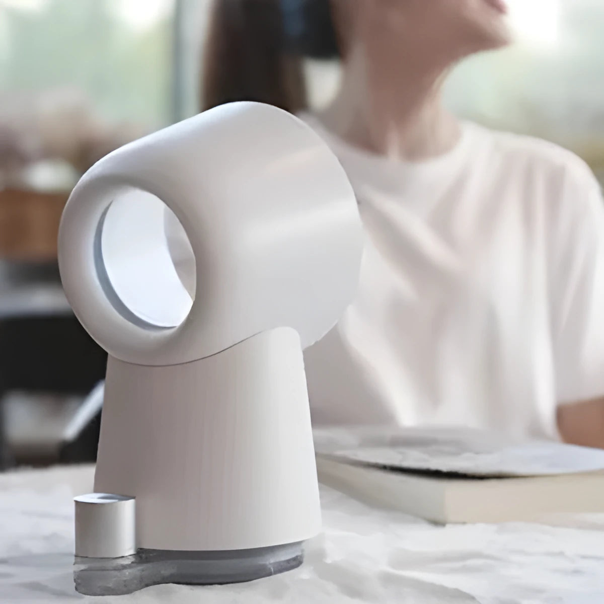 White desktop bladeless fan with USB humidification, 3 speed settings, and LED light on a desk