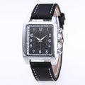 Men's quartz analog watch with metal case and brown leather band on wrist