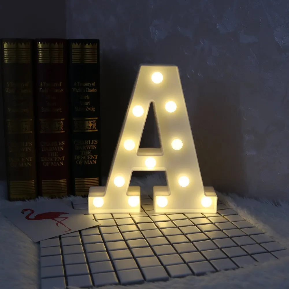 White plastic LED marquee letter sign with warm white glow, 22cm tall