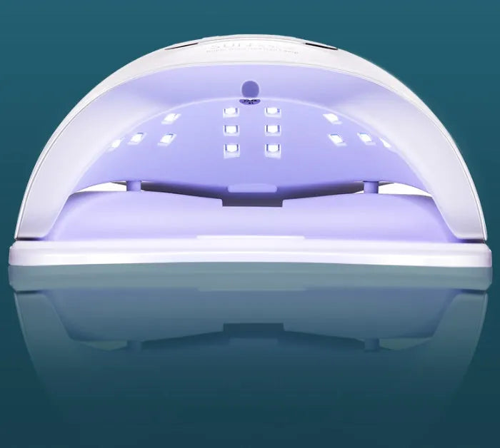 White ABS plastic nail curing lamp with dual UV and LED lights and timer buttons.