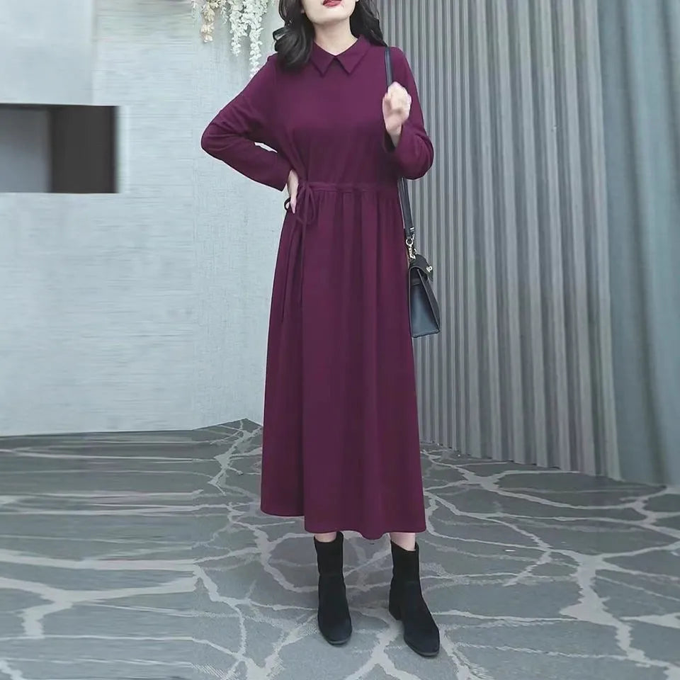 Purplish red plus size long sleeve dress for women on a hanger, showing long skirt urban style.