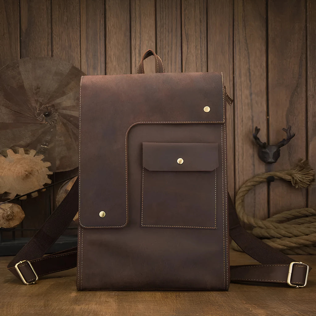 Dark brown genuine leather men's travel bag with shoulder straps and top handle.