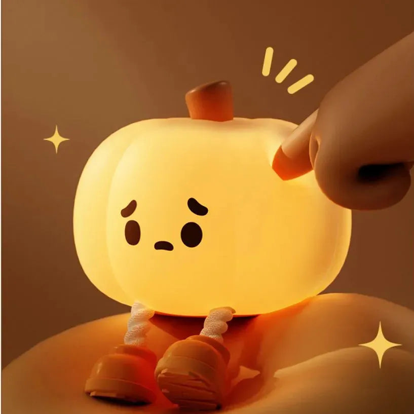 Soft silicone pumpkin-shaped night light with orange colour and touch dimming controls