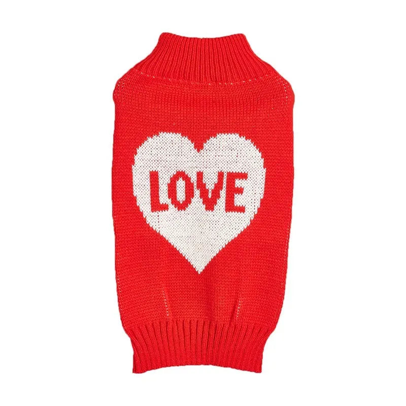 Dog wearing acrylic sweater with embroidered bow and heart patterns