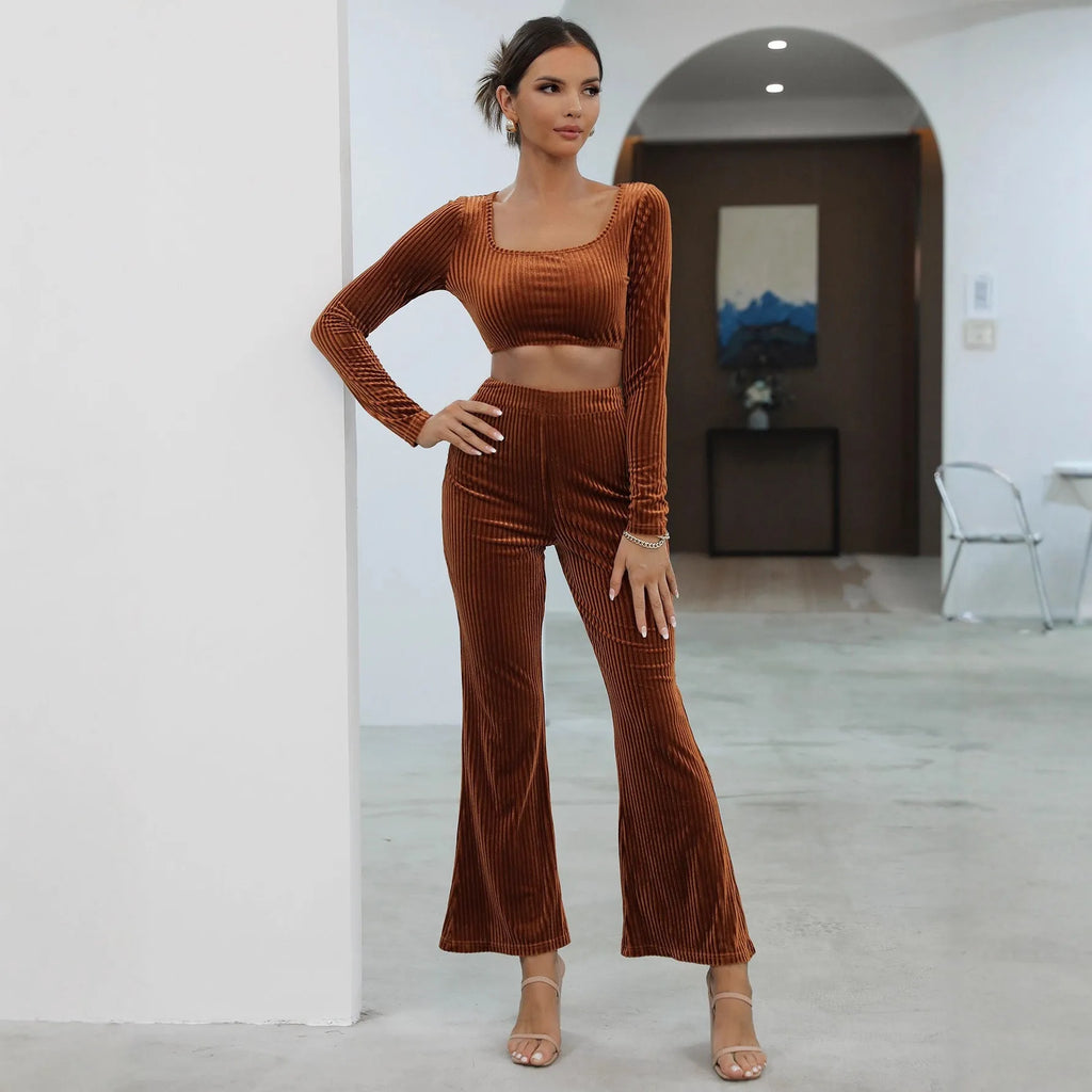 Caramel coloured long sleeve sweater and trousers co-ord set on a hanger