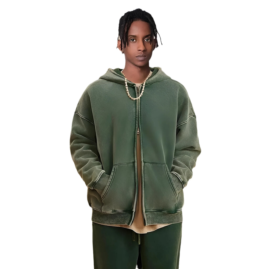 Man wearing a washed black cotton fleece-lined hooded cardigan with a double zipper front.