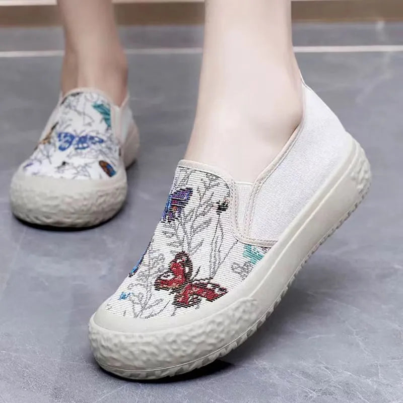 Women's canvas slip-on shoes with plastic injection-moulded sole and decorative sewing thread details