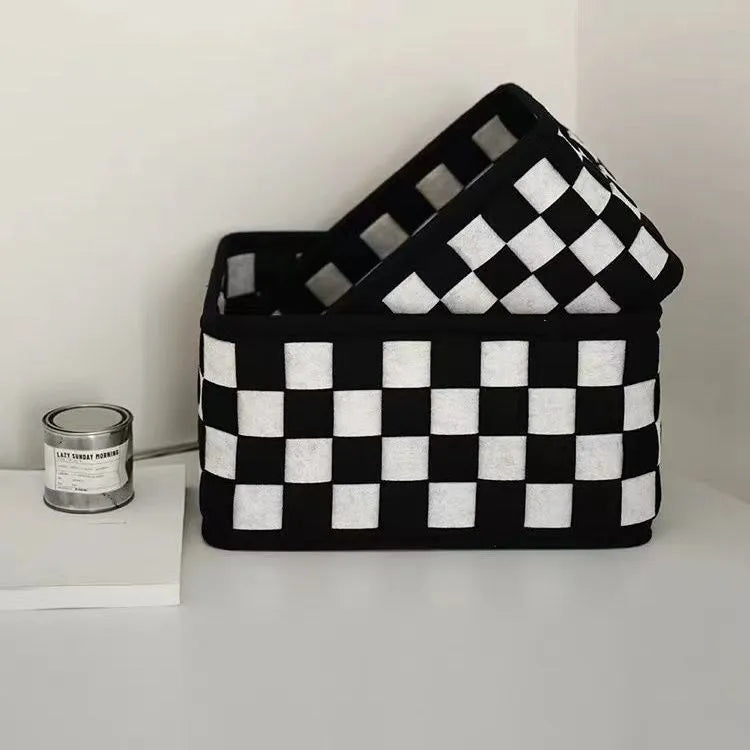 Checkerboard patterned grey felt folding storage basket with dimensions 37cm by 29cm.