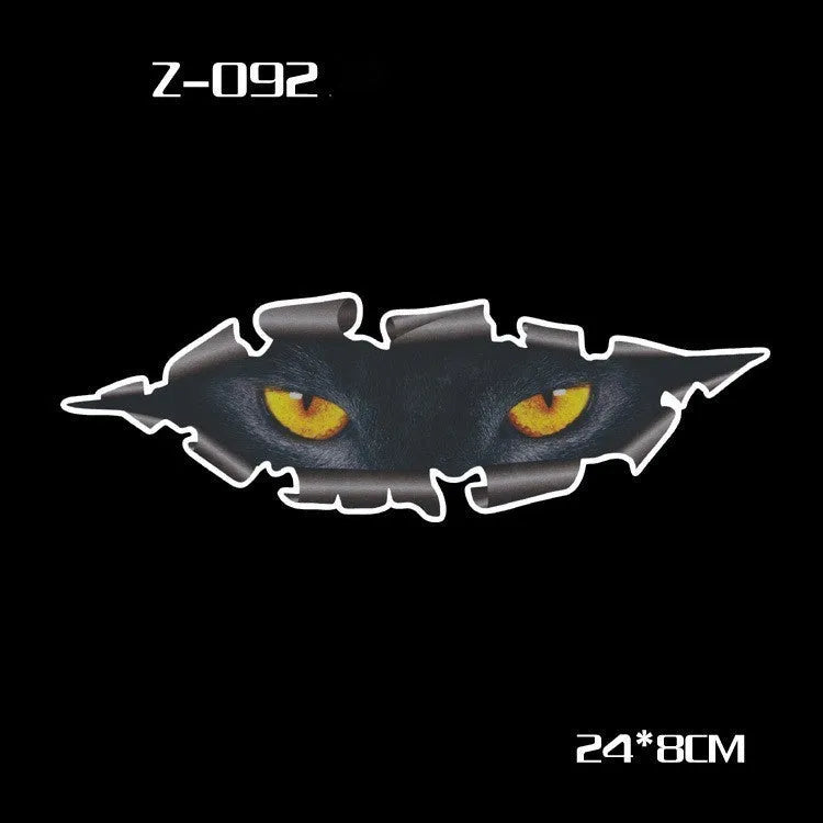 Pair of reflective cartoon eye car stickers on a vehicle rearview mirror and door panel.