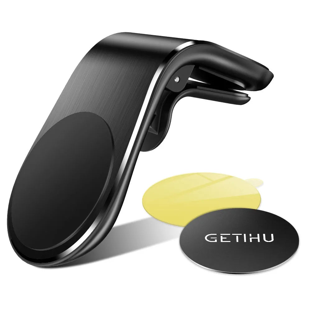 Black universal car phone holder bracket mounted on a car dashboard holding a smartphone.