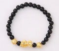 Imitation obsidian bracelet with 18K gold, little pearl and six brave words on hand