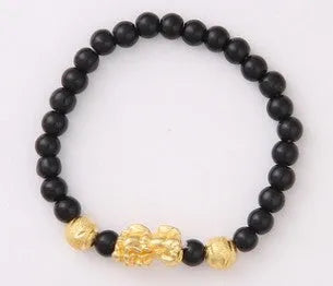 Imitation obsidian bracelet with 18K gold, little pearl and six brave words on hand