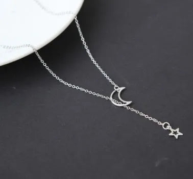 Simple moon star clavicle necklace in alloy with diamond treatment, shown in golden and silver colour options.