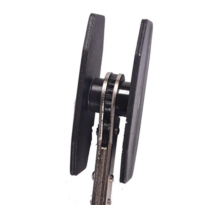 Black stainless steel brake caliper press with ratchet mechanism, 270mm length, on a workshop bench