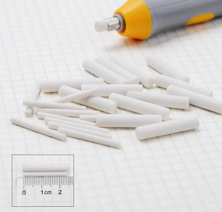 Black electric eraser with plastic body and geometric design on a white background