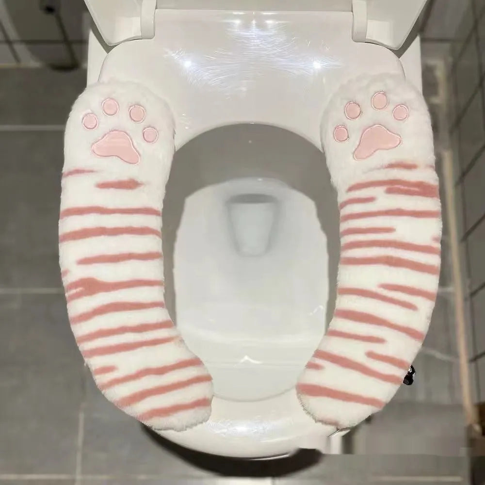 Plush toilet seat cushion with adhesive Velcro fastener in black and white stripes for bathroom use